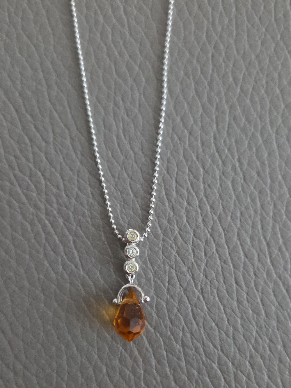 Nadri Silver-tone Amber Teardrop Necklace with Accents